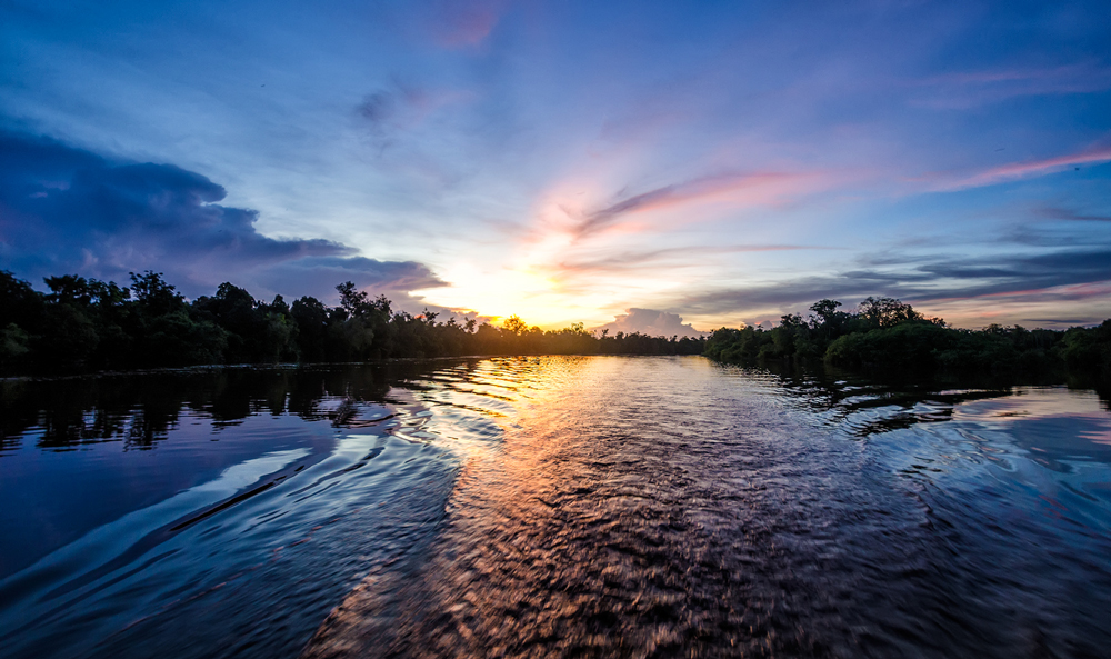 Dawn or dusk? Sunset over the  Rungan River in Kalimantan, Indonesia