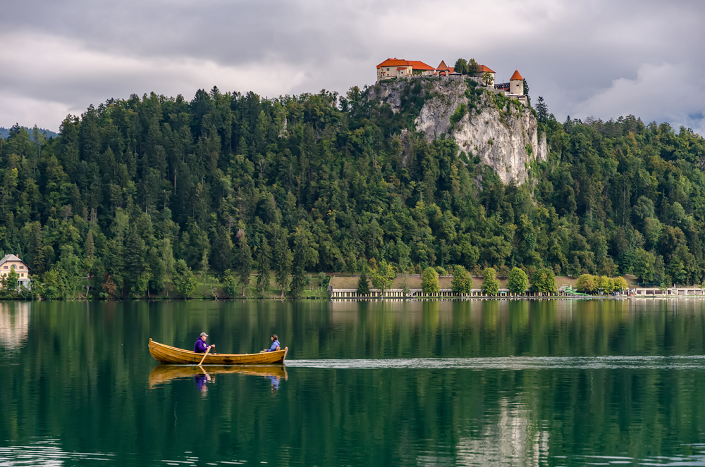 Rowing across the emerald waters of Lake Bled