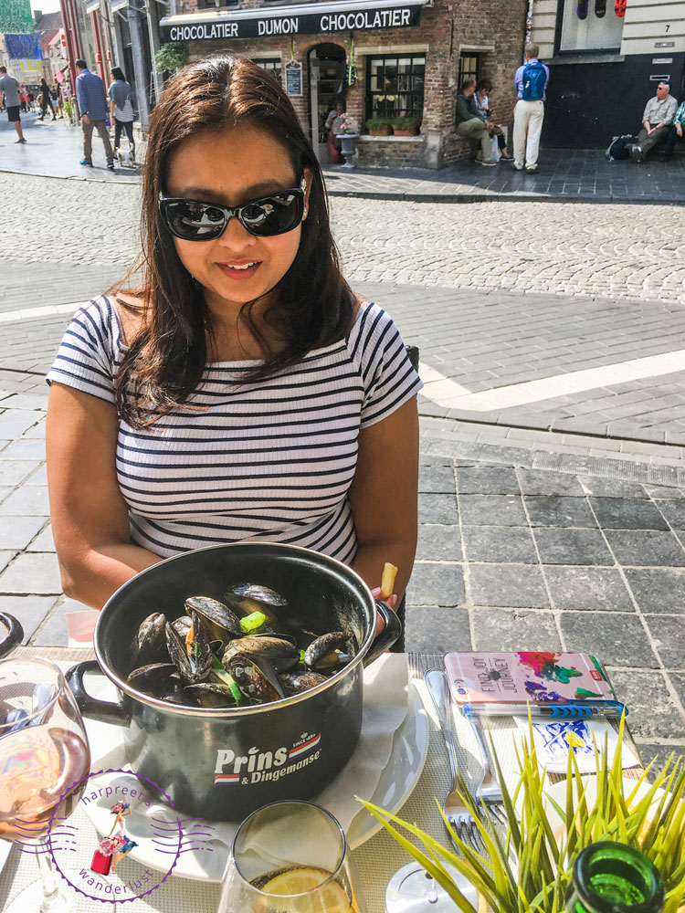 Harpreet-eating-moules-in-Brugges