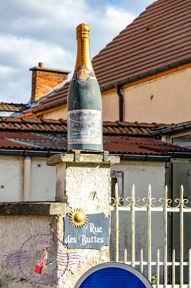 A champagne bottle on a gate in Hautvillers 