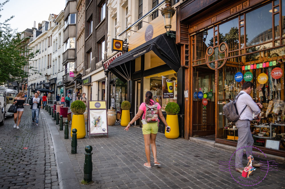 Harpreet on a street in Brussels outside a chocolate shop